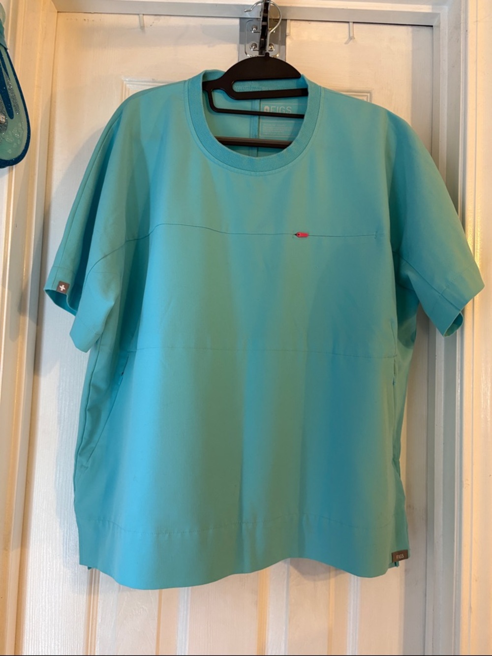 Figs limited edition top in aqua. Women’s medium. Imperfection photographed.